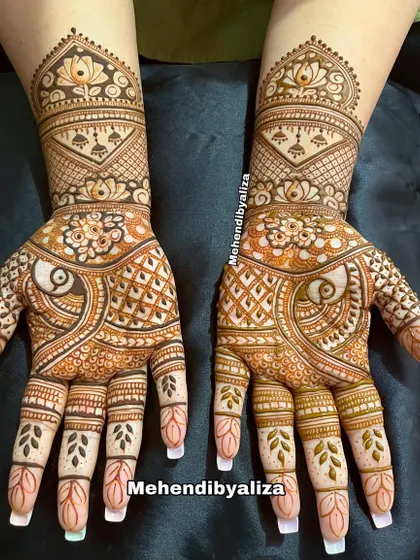 The final look of this Teej festival henna. The combination of paisleys and checkerboard patterns gives it a traditional yet stylish feel.