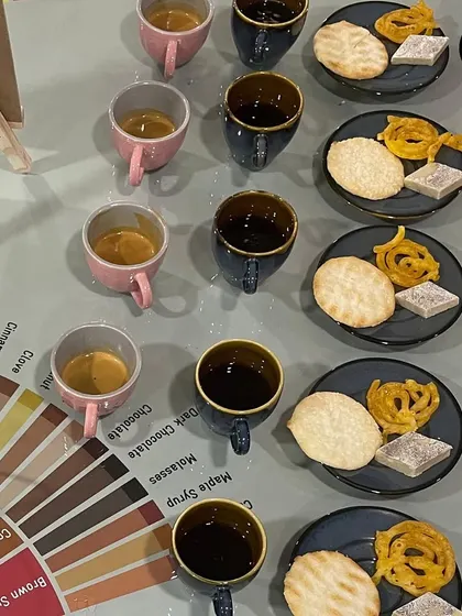 A top-down view of the coffee and sweets pairing. We use both black coffee and milk coffee to show how milk changes the pairing dynamics.