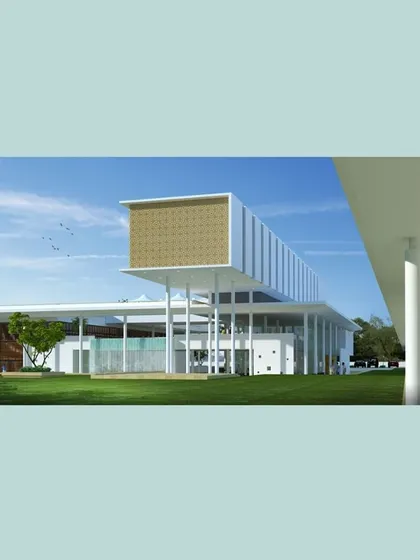 The play of materials and the arrangement of volumes alter the ambiance of different zones within the Pavilion. This view shows the relationship between the main hall and the expansive surrounding landscape.