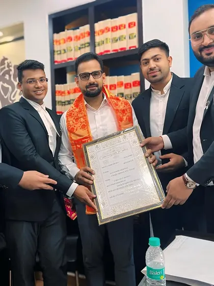 Presenting a certificate of appreciation to the newly elected Secretary of the Rohini Court Bar Association with my team.