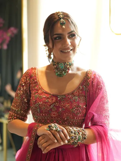 A final look from our collaboration with Purab Paschim and Ridhi Mehra. The combination of the vibrant fuchsia lehenga and the eclectic, multi-colored jewelry created a stunning look for Mehendi inspiration.