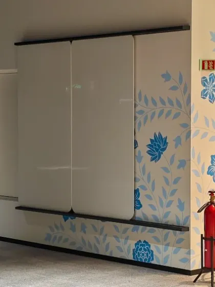 For Takeda's Bangalore office, we created this elegant "Tree of Life" mural. The design is a beautiful fusion of Indian and Japanese floral styles, bringing a sense of calm and organic growth to the workspace.