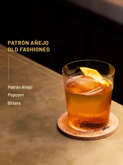 The Patrón Añejo Old Fashioned, a sophisticated cocktail with a hint of popcorn flavour.