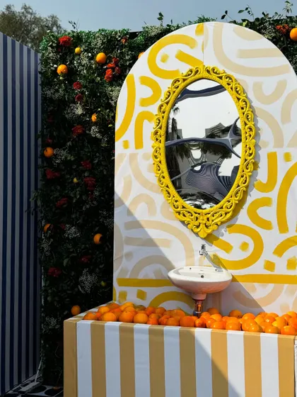 Our creativity shines in unique festival decor, like this St. Tropez inspired setup for Uttarayan. We used bold patterns, a vibrant yellow and blue color palette, and unconventional elements like a sink filled with oranges to create a playful and artistic vibe.