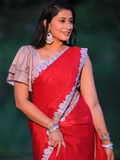 Another angle of the red saree, showing off the delicate silver waist chain.