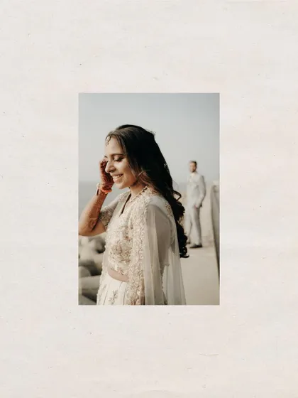 A creative shot with a focus on her, while he stands in the background. It tells a story of anticipation and love.