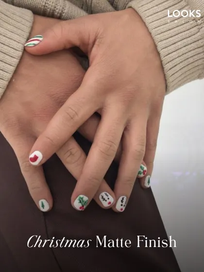Getting into the festive spirit with a Christmas Matte Finish manicure. This design features fun, hand-painted holiday motifs on a clean white base, proving that seasonal nail art is for everyone.