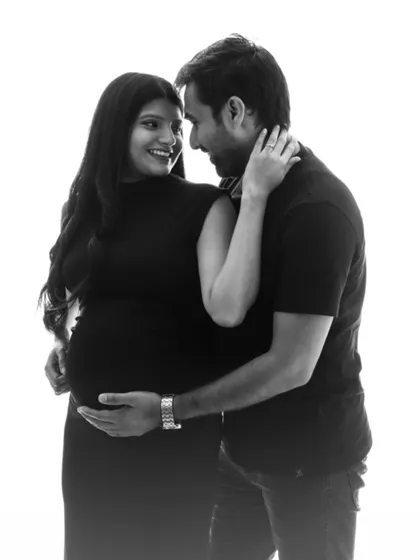 A joyful and intimate black and white portrait of a couple, their smiles and connection shining through.