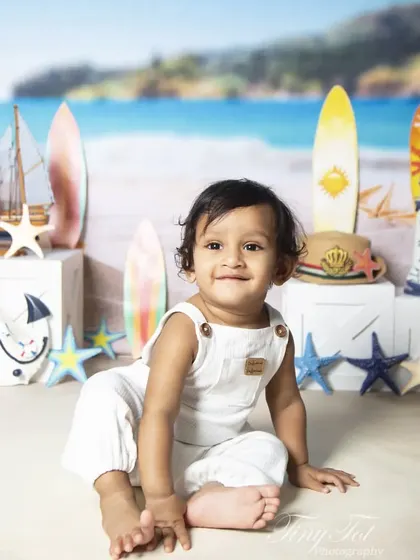 A happy baby enjoying a day at the 'beach' in my studio. This nautical theme is perfect for capturing sunny smiles.