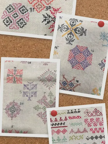 A collage of different Kasuti embroidery samples pinned to a board. This shows the journey of learning and practicing the diverse motifs that make up this art form.