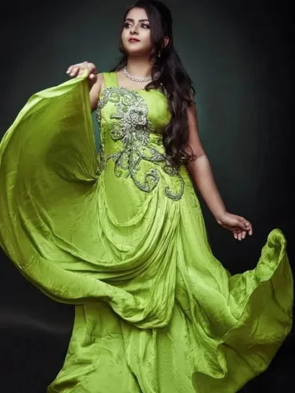 This lime green satin gown is a bold and stylish choice. The flowing fabric is perfect for creating movement in photos.