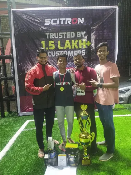 Our instructors celebrating with Yash Mhaprolkar after his championship win. We believe in supporting our students in all their endeavors, both inside and outside the dojo.