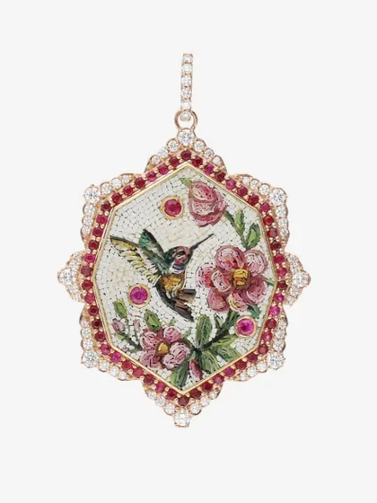This hexagonal pendant captures the romantic connection between a hummingbird and flowers. The vibrant micromosaic is inlaid with rubies and framed with diamonds, creating an enchanting piece of jewelry.