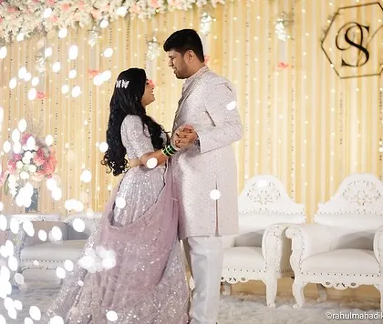 A romantic dance pose on the reception stage.