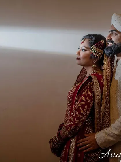 A simple, elegant portrait using a single beam of light. This technique creates a dramatic, focused image that highlights the couple's profile.