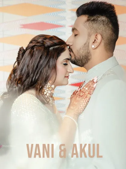 A classic romantic portrait with the groom kissing the bride's forehead, their names elegantly overlaid.