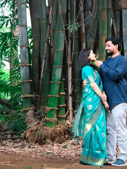 A full-length shot of a couple sharing a loving gaze in a bamboo grove, capturing the serene beauty of the natural surroundings in their pre-wedding photography.