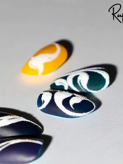 A collection of swirl designs created with the sand or sugar technique for a unique, textured finish.