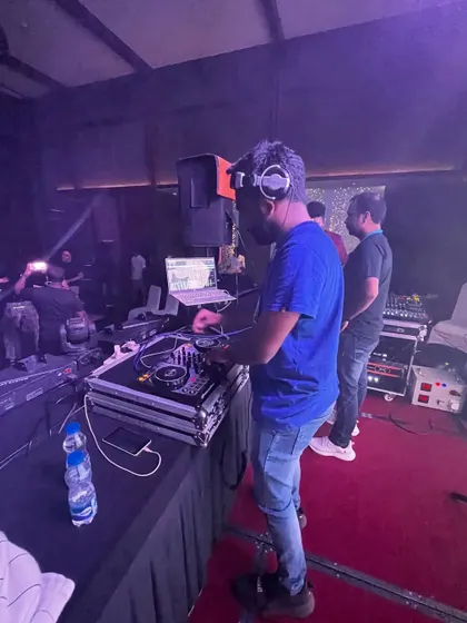 A side view of my setup during an indoor event. You can see the arrangement of my laptop, controller, and headphones for a smooth workflow.