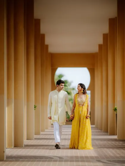 A classic walking shot of the couple, hand in hand, through a beautiful colonnade. This type of shot is timeless and elegant.