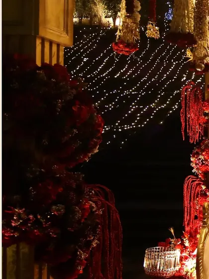 A detail shot of the floral arrangements and fairy lights that created a magical backdrop for the traditional wedding ceremony.