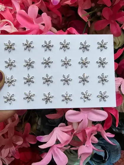 Our beautiful snowflake studs, perfect for adding a touch of winter magic to your look.