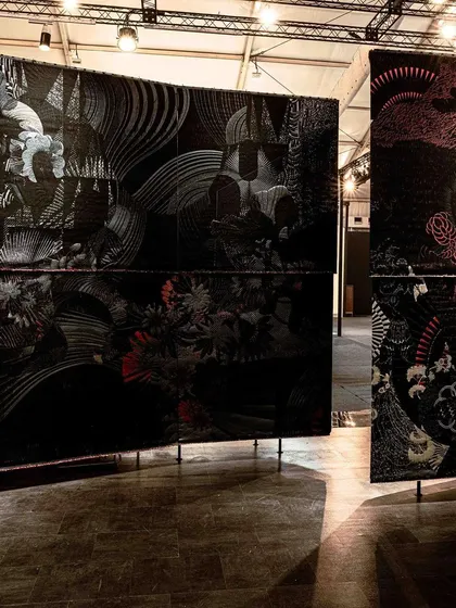 A detail of the woven panels from the 'Gothilicious' installation. The visual language of stylized tattoo art meanders across the surface, creating a sense of mystery, complexity, and beauty that defines the new Goth culture.