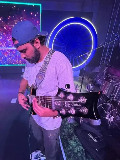 Our guitarist, focused and ready. We rely on each other's strengths to deliver a great show.