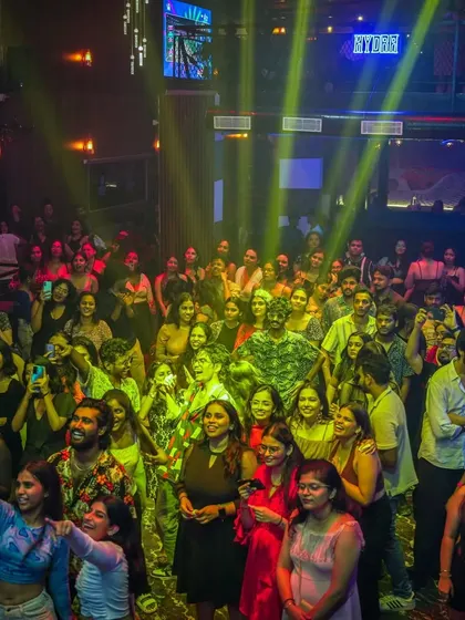 Another perspective of the energized crowd at Hydra, showing the scale of the party from the side of the room.
