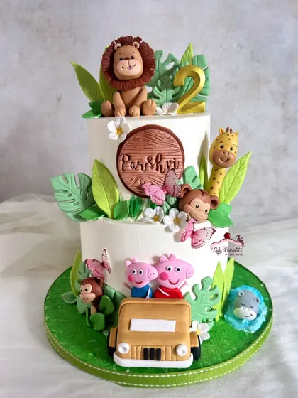 What a fun theme! This cake imagines Peppa and George on a jungle safari, complete with a jeep and friendly wild animals. It's a creative twist on two popular themes.