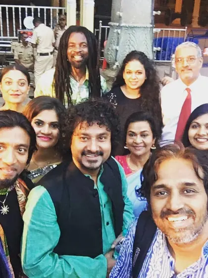 A happy moment with fellow musicians after an amazing concert at Mysuru Palace. The camaraderie and shared energy backstage are just as special as the performance itself.