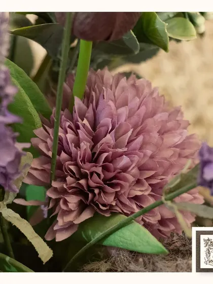 A close-up of the beautiful, textured petals of a dusty pink artificial flower from one of my arrangements. The level of detail ensures a realistic and elegant look.