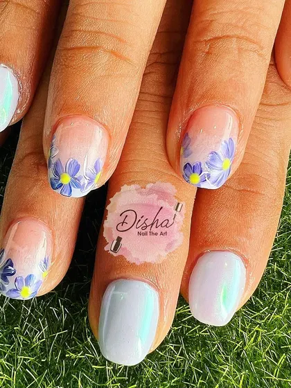 Hand-painted flowers in their most organic form. This lovely design features a pearlescent white base with delicate, free-flowing purple flowers.