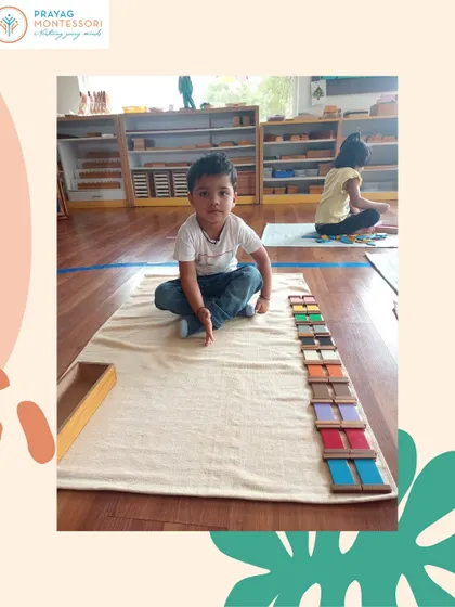This child has successfully graded the color tablets from darkest to lightest. This sensorial exercise trains the eye to perceive subtle differences in color, a skill useful in arts and sciences.
