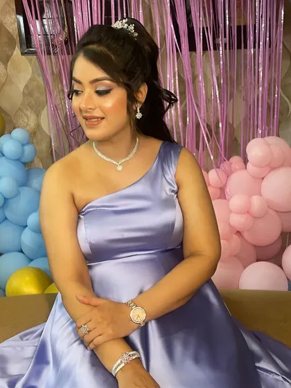 A close-up showing her elegant half-up hairstyle and the delicate details of her makeup.