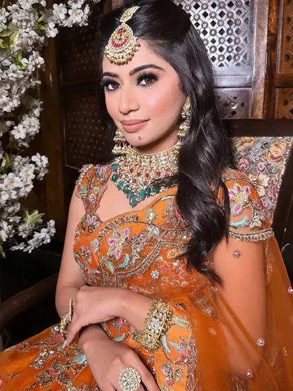 A close-up of the engagement makeup. The subtle bindi and the beautiful mole add a touch of personal charm to her stunning look.