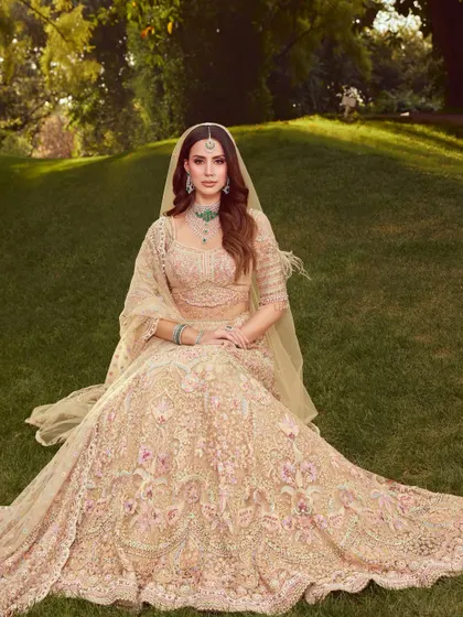 A breathtaking wide shot of the bride in a beautiful garden setting. The soft and dewy makeup looks fresh and timeless in the natural light.