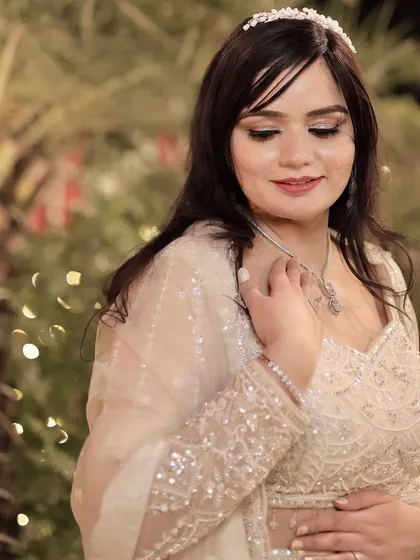 A beautiful profile shot of the bride, her hair and makeup looking soft and romantic.
