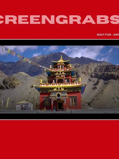 A wide, cinematic shot of a monastery in Spiti Valley, establishing the unique and remote setting for the Airtel ad campaign.