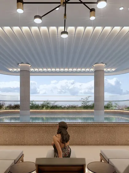 The serene poolside at our boutique apartment building in Nagpur. Surrounded by nature with sweeping views, this space features carefully selected tones and textures to create a perfect ambiance where luxury and tranquility coexist.