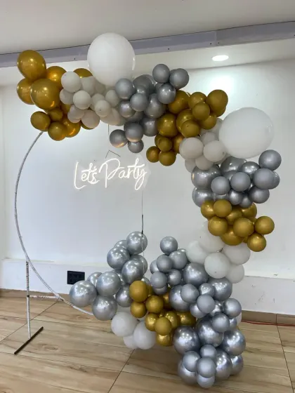 Another angle of the versatile silver and gold party backdrop, suitable for birthdays, anniversaries, or even New Year's Eve parties.