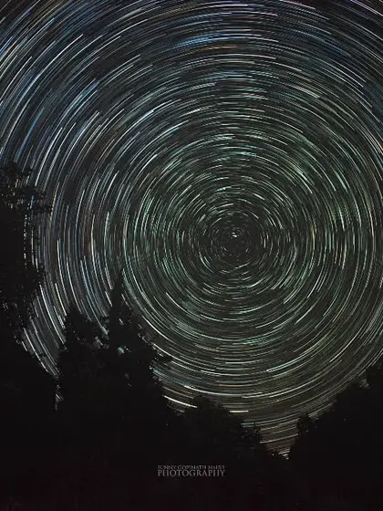Capturing these star trails over the forests of Chopta meant spending a night in the freezing cold, but it was completely worth it. This is a long exposure photograph, a composite of many shots, that shows the Earth's rotation against the backdrop of the night sky.