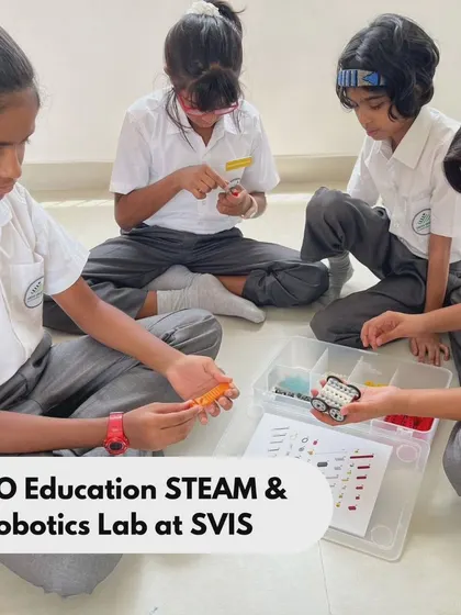 Teamwork in action at SVIS as students sort through LEGO parts and assemble their model. Our programs teach organization and systematic thinking through hands-on activities.