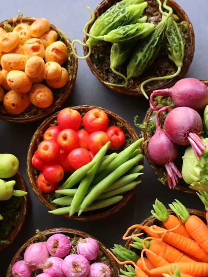 Another angle of the vegetable baskets, showing the detail in the tomatoes, beans, and potatoes.