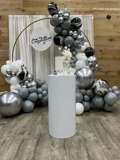 A modern and sleek "Congratulations" backdrop with a silver, grey, and white color scheme. The metallic and marbled balloons add a sophisticated touch, making it ideal for a graduation party, promotion celebration, or engagement.