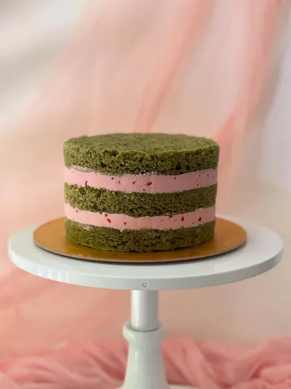 This is what my cakes look like on the inside. This "naked" view shows the layers of matcha-flavoured cake and strawberry buttercream, because flavour is always my top priority.