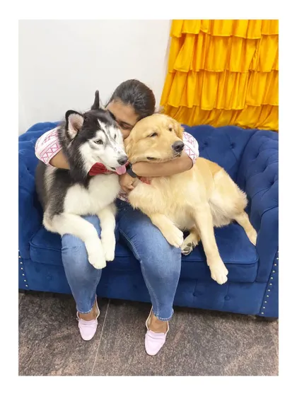 A lap full of love. Cuddling with these two brothers, a Husky and a Golden Retriever, after their grooming session is the best part of my day.
