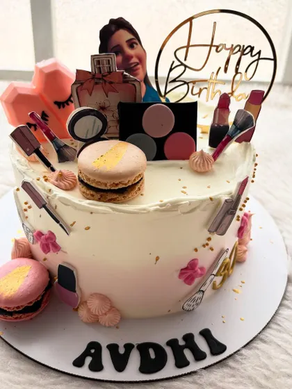 Another take on the makeup theme, this time with edible photo prints of makeup items, macarons, and a picture of the birthday girl.