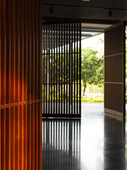 Pivoting wooden screens at the Amara Raja campus allow for flexible control of light and privacy. This detail shows how we use natural materials to create adaptable and breathable spaces.