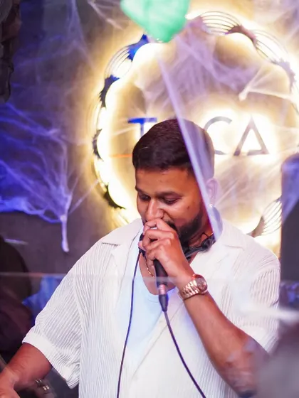 On the mic during a Halloween party at Toca.